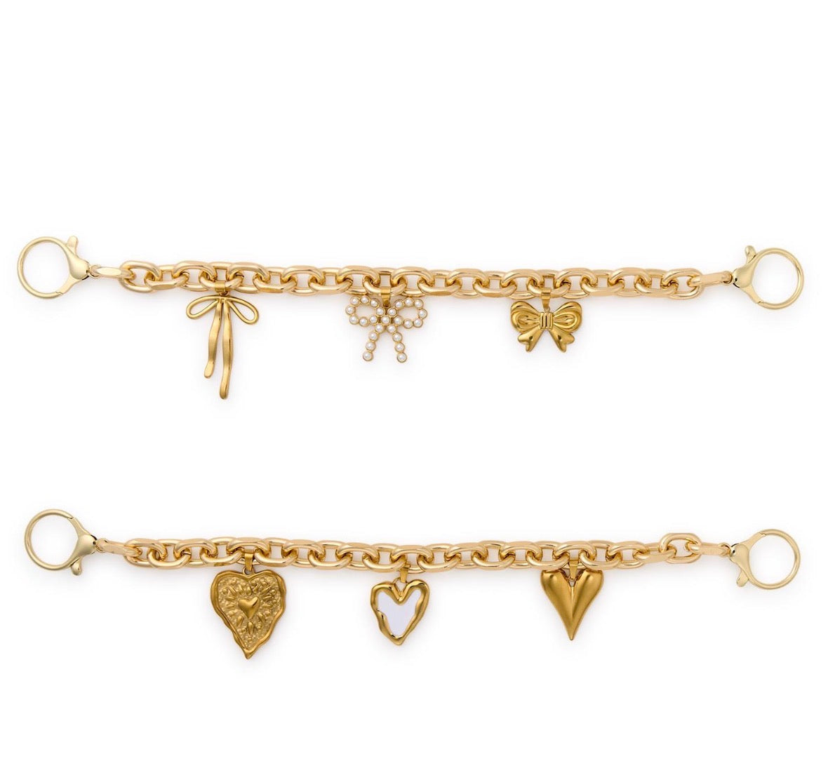 Two gold chain-link bag charms, each with three detailed gold charms—bows, hearts, and a lion's head—and pearl accents; available in small and medium sizes.
