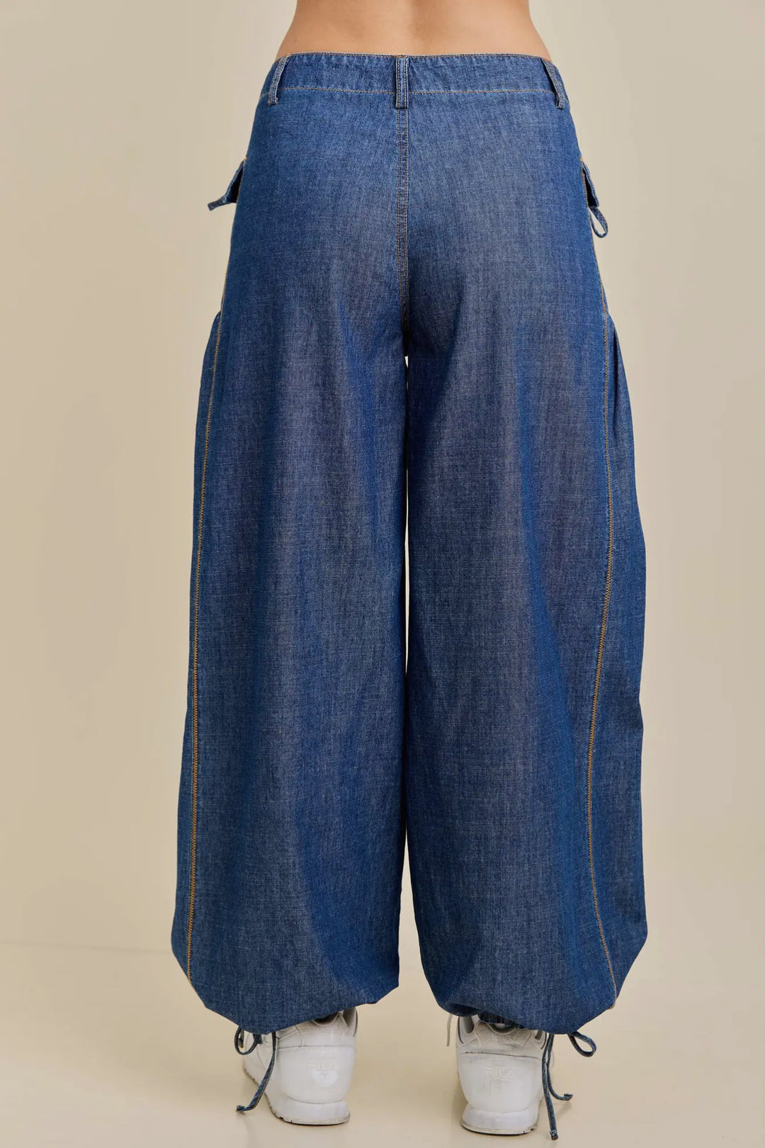 Dual-Style Wide-Leg Cinched Jogger with ankle drawstrings and side pockets. Available in sizes XS–XL.