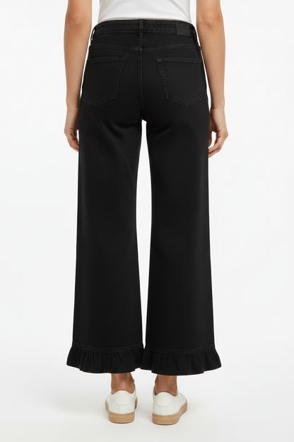 Mineral Washed Ruffle Hem Wide Leg Pants in black, wide-leg fit with ruffle hem; available in sizes S-XL.