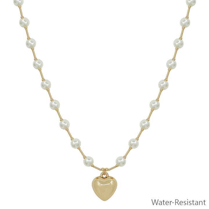 Water-resistant 6MM pearl beaded chain with gold bars and puffy heart pendant. Available sizes: 16", 18".