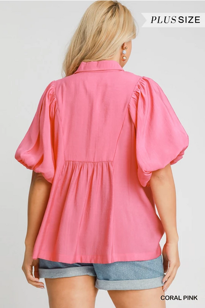 Maggie Bubble Sleeve Top in coral pink, available in plus sizes. "PLUS SIZE" and "CORAL PINK" text highlight the product.