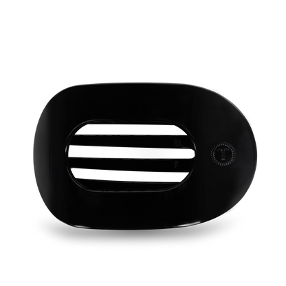 Black oval TELETIES Flat Round Hair Clip with slats and right-side “T” button. Available in small, medium, and large sizes.