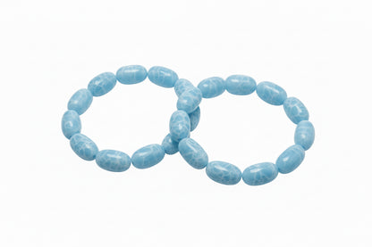 Light blue oval marble-patterned stone stretch bracelets. Available in sizes S, M, and L.