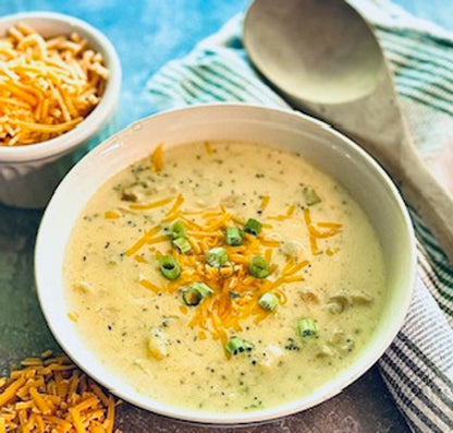 Creamy Broccoli Cheddar Soup Mix with shredded cheddar and green onions. Available in small, medium, and large sizes.