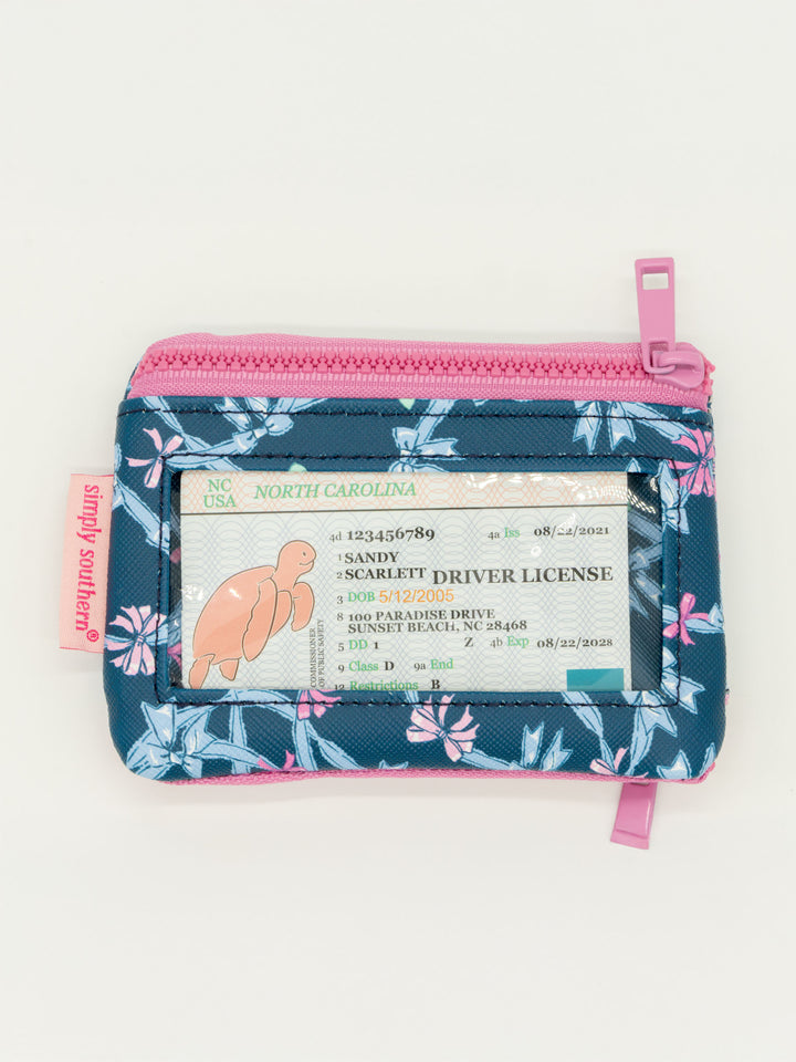 Small floral blue and pink key chain wallet with zip pockets and clear ID window; available in one compact size.