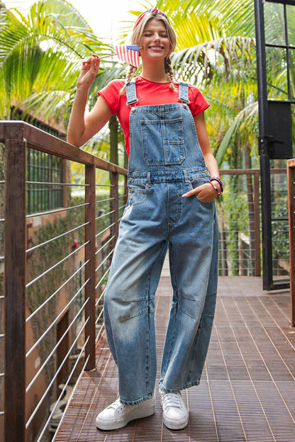 Dakota Mineral Wash Denim Jumpsuit shown; available in sizes XS-XL.
