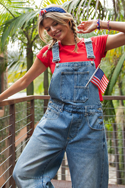 Dakota Mineral Wash Denim Jumpsuit shown; available in sizes XS–XL.