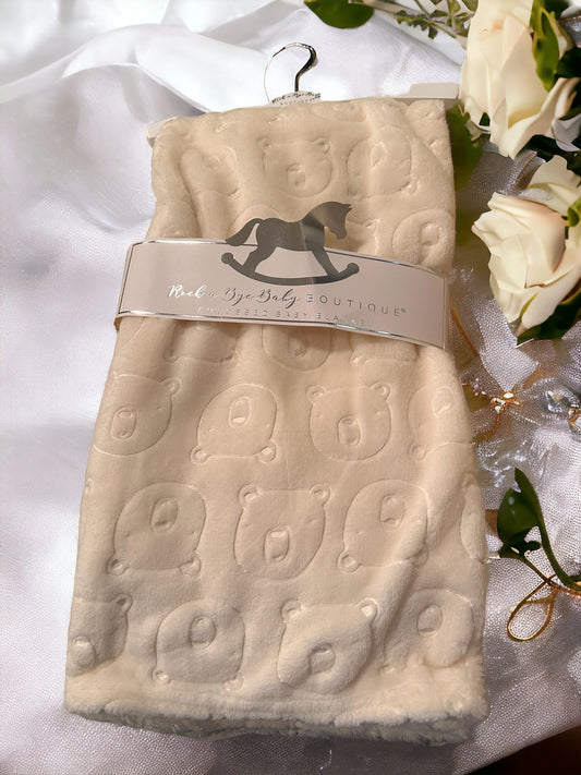 White embossed baby blanket featuring bears