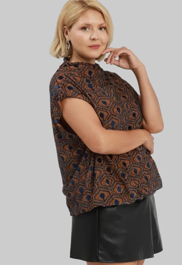 Rust velvet mock neck top with a blue and brown geometric print and bubble silhouette. Available in various sizes.