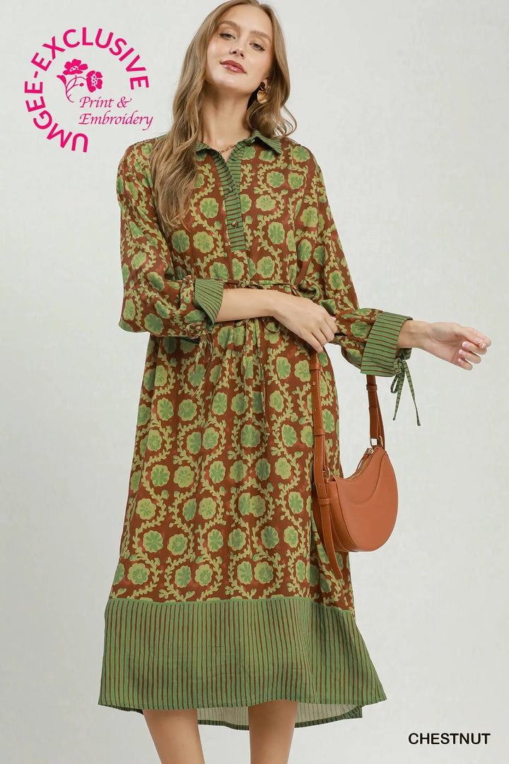 Mixed Media Print Midi Dress in brown and green floral, featuring a collared neckline, button-up placket, and striped trim on the cuffs and hem.
