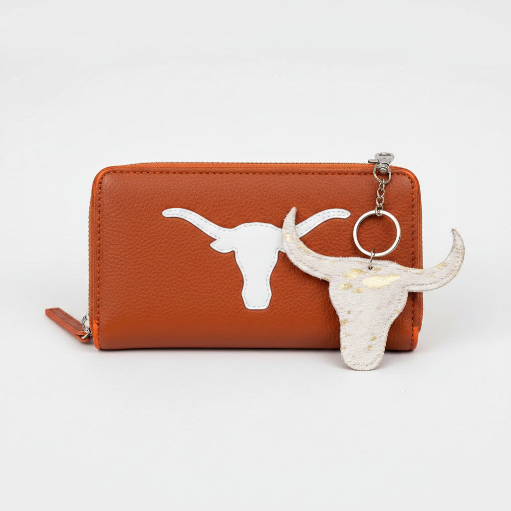 Orange wallet with white longhorn silhouette. Available in small, medium, and large sizes.