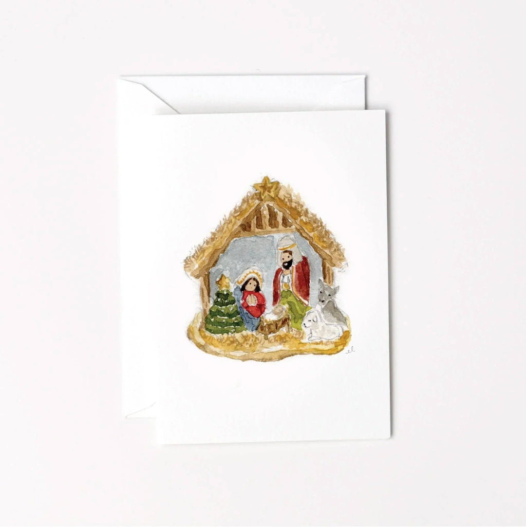 Watercolor Nativity ornament mini enclosure notecard featuring Mary, Joseph, baby Jesus, a stable, a Christmas tree, and a lamb.