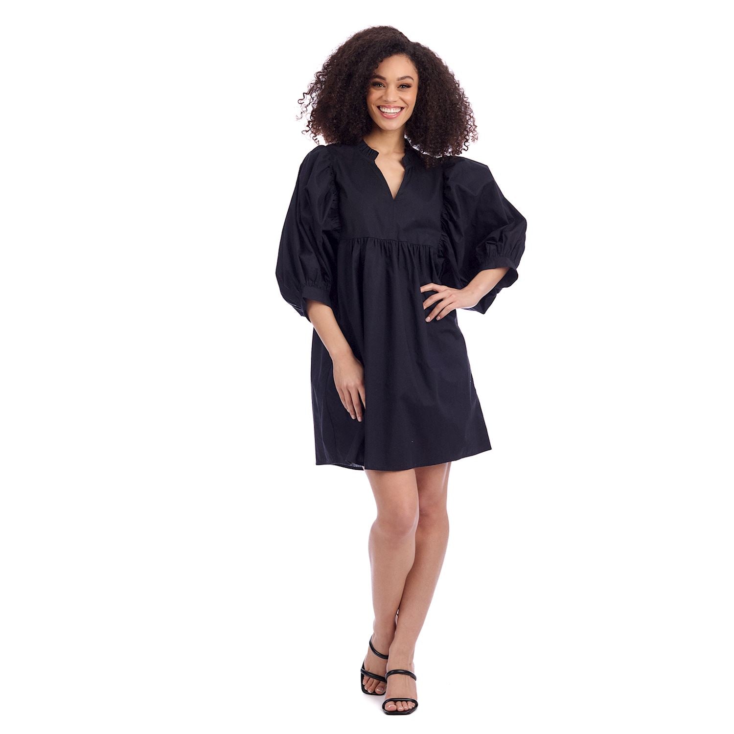 Black Shipley Dress featuring puffed sleeves and knee-length cotton poplin. Available in sizes XS–XL.