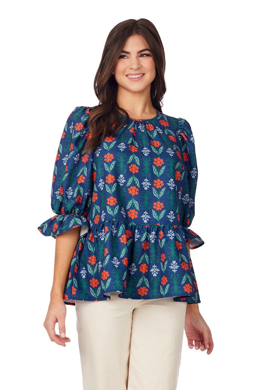 Navy Floral Pierce Flounce Top with vibrant floral print and peplum waist. Available in sizes XS-XL.