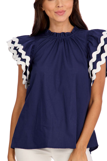 Angie Ric Rac Top: Navy blue cotton poplin blouse with flutter sleeves, white wavy trim, and gathered neckline. Available in sizes XS to XL.