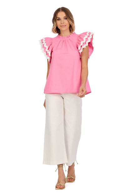 Angie Ric Rac Top features flutter sleeves and a playful ric rac design. Available sizes: XS, S, M, L, XL.