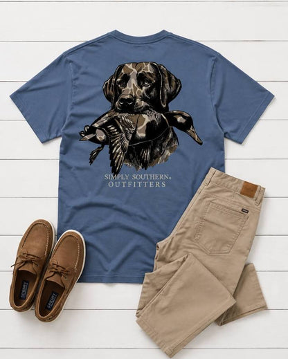 Men’s Blue Camo Dog Shirt with a graphic of a dog holding a duck and “Simply Southern Outfitters” text. Available in sizes S-XXL.