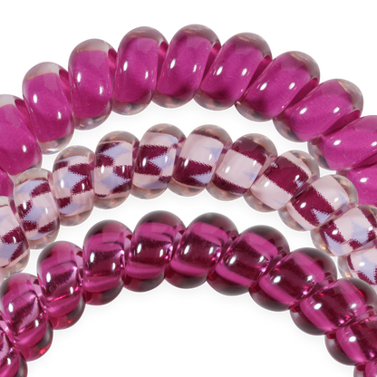 Set of three small Merlot after Midnight TELETIES hair ties in deep wine and clear shades, featuring spiral coils for a shiny, no-crease hold. Available in small size.