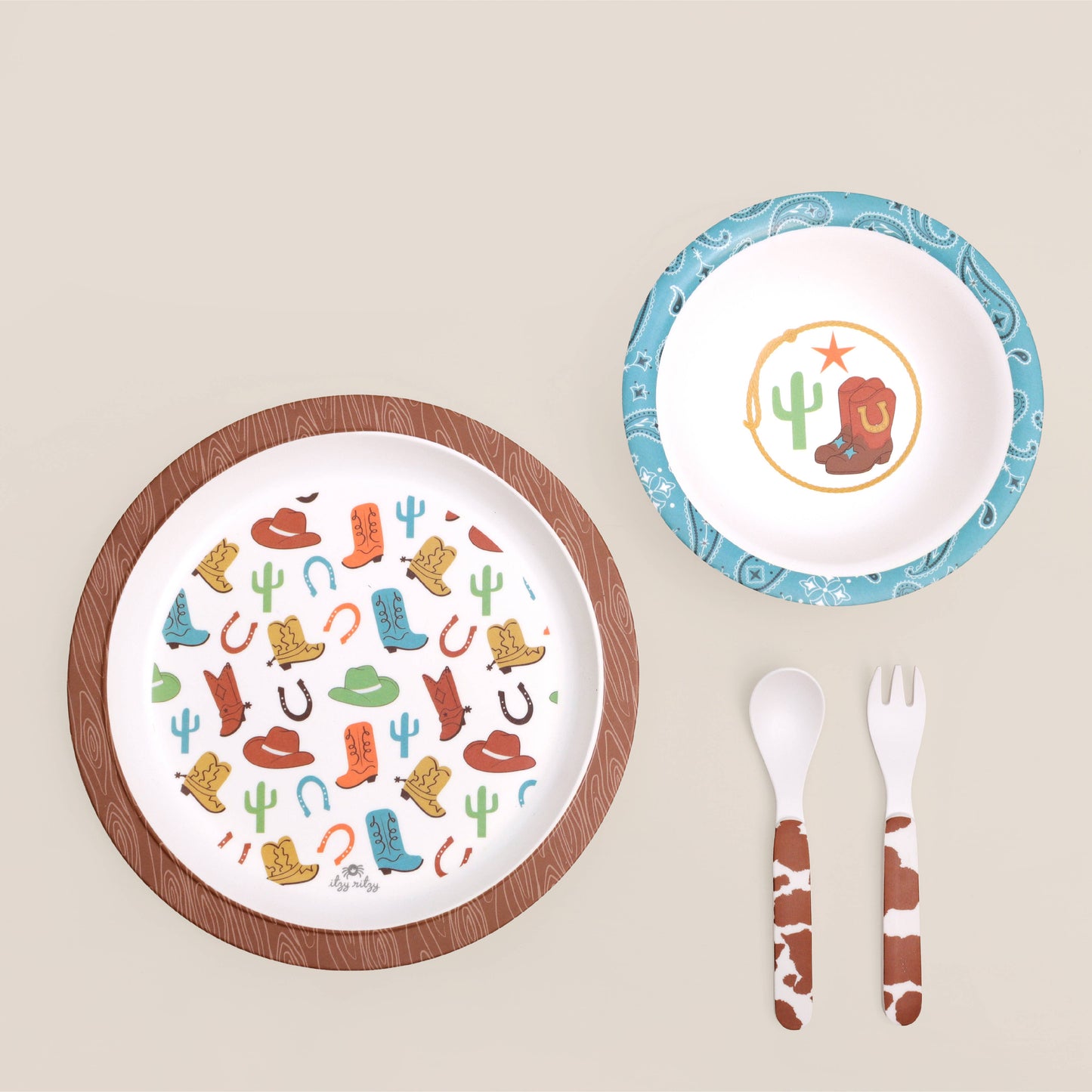 Itzy Bistro™ 4-piece set: plate, bowl, spoon, fork with cowboy prints, BPA-free melamine. Sizes: toddler.