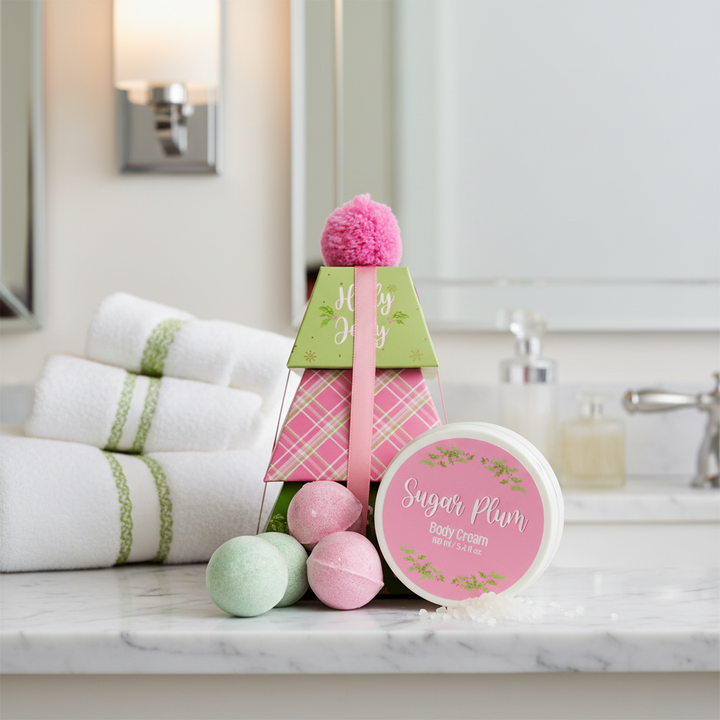 Holly Jolly Bath Gift Set | Sugar Plum: tree-shaped gift box with pink pom-pom, three bath bombs, and 5.4 oz body cream.