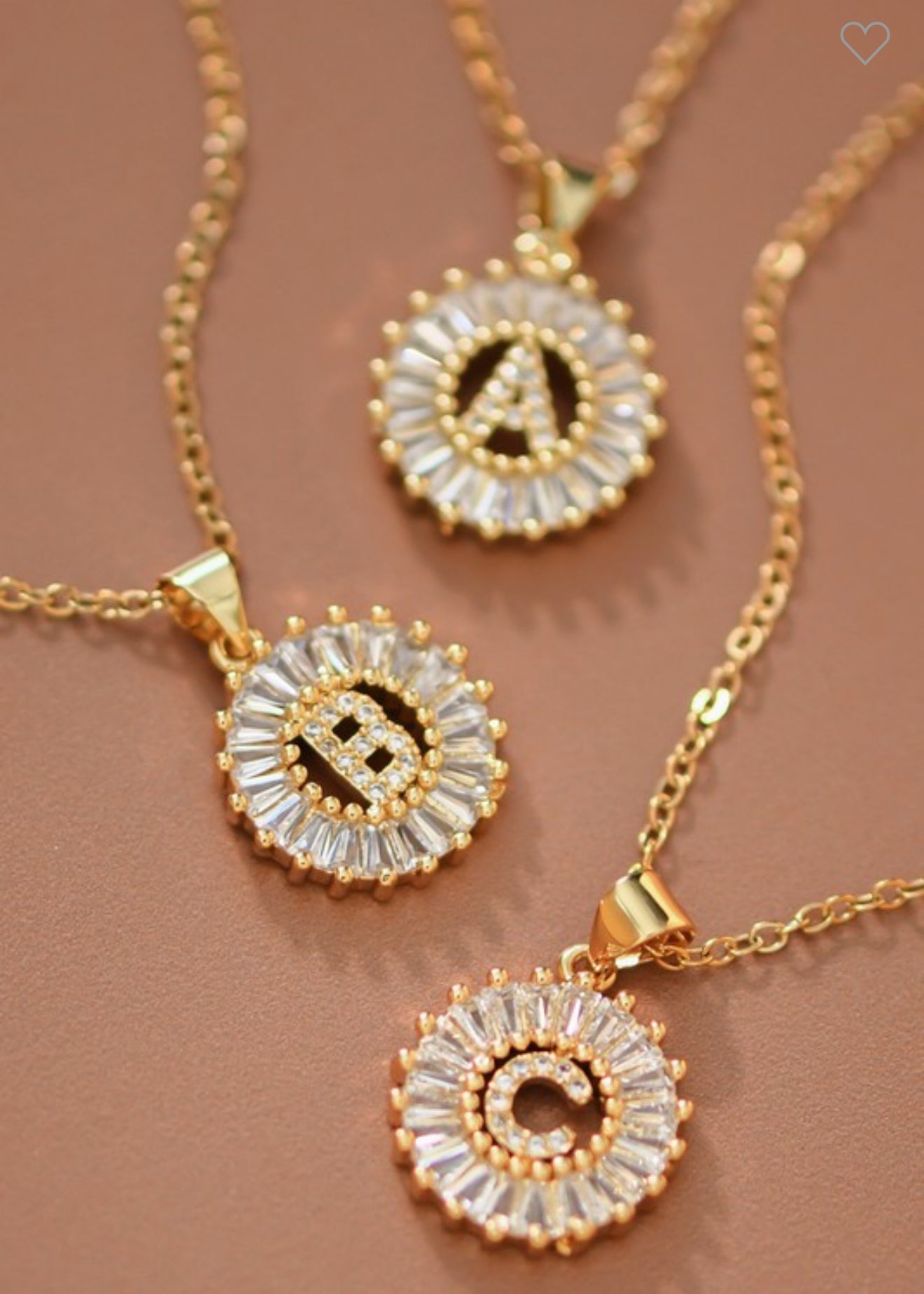 Stainless steel necklaces with round CZ initial pendants, letters A, B, and C. Available in sizes 16", 18", and 20".