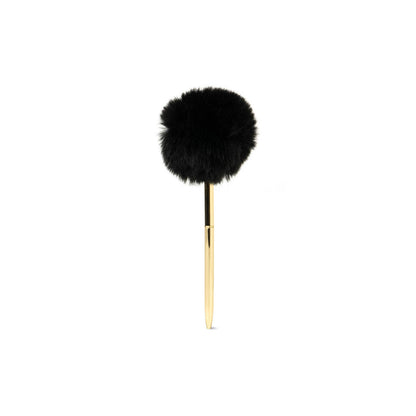 The Crush Noted Pom Pen has a goldtone barrel and a large, round black puff on top. Sizes available: not specified.