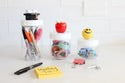 Set of three clear jars with white lids for organizing supplies; available in multiple sizes.