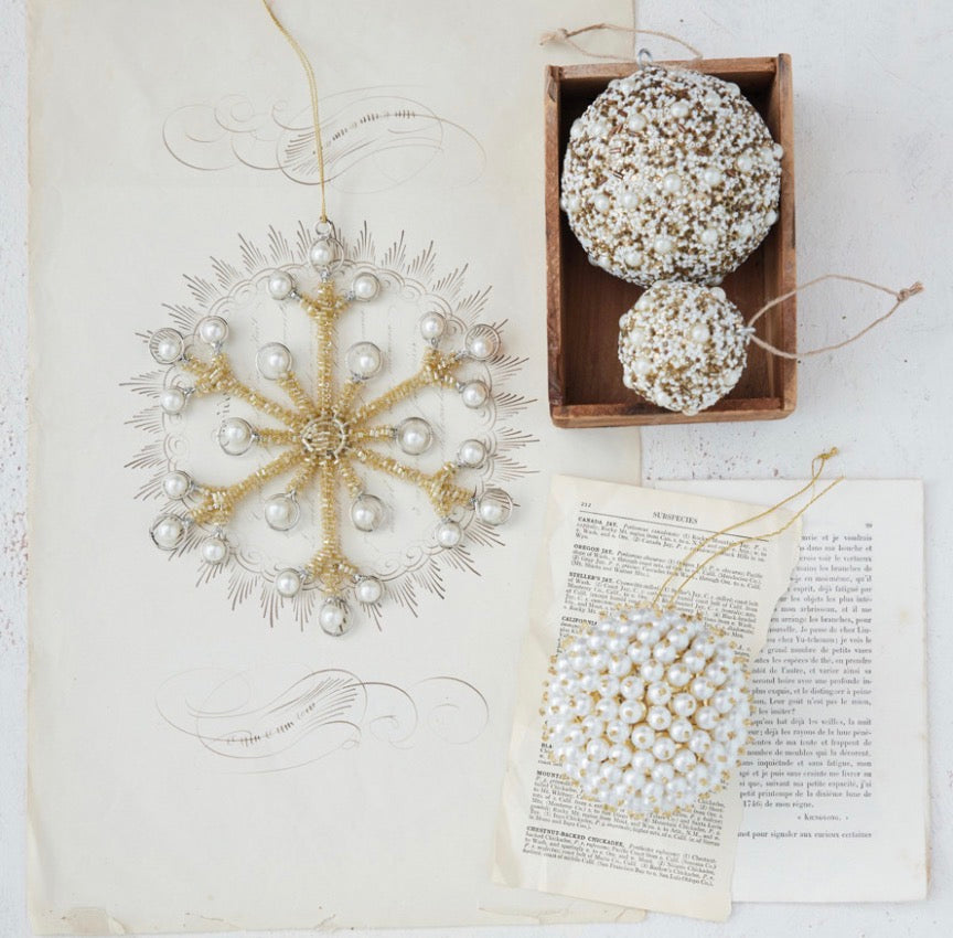 Star-shaped wire and bead ornament, two Ivory Beaded Ball ornaments, and a circular ornament.