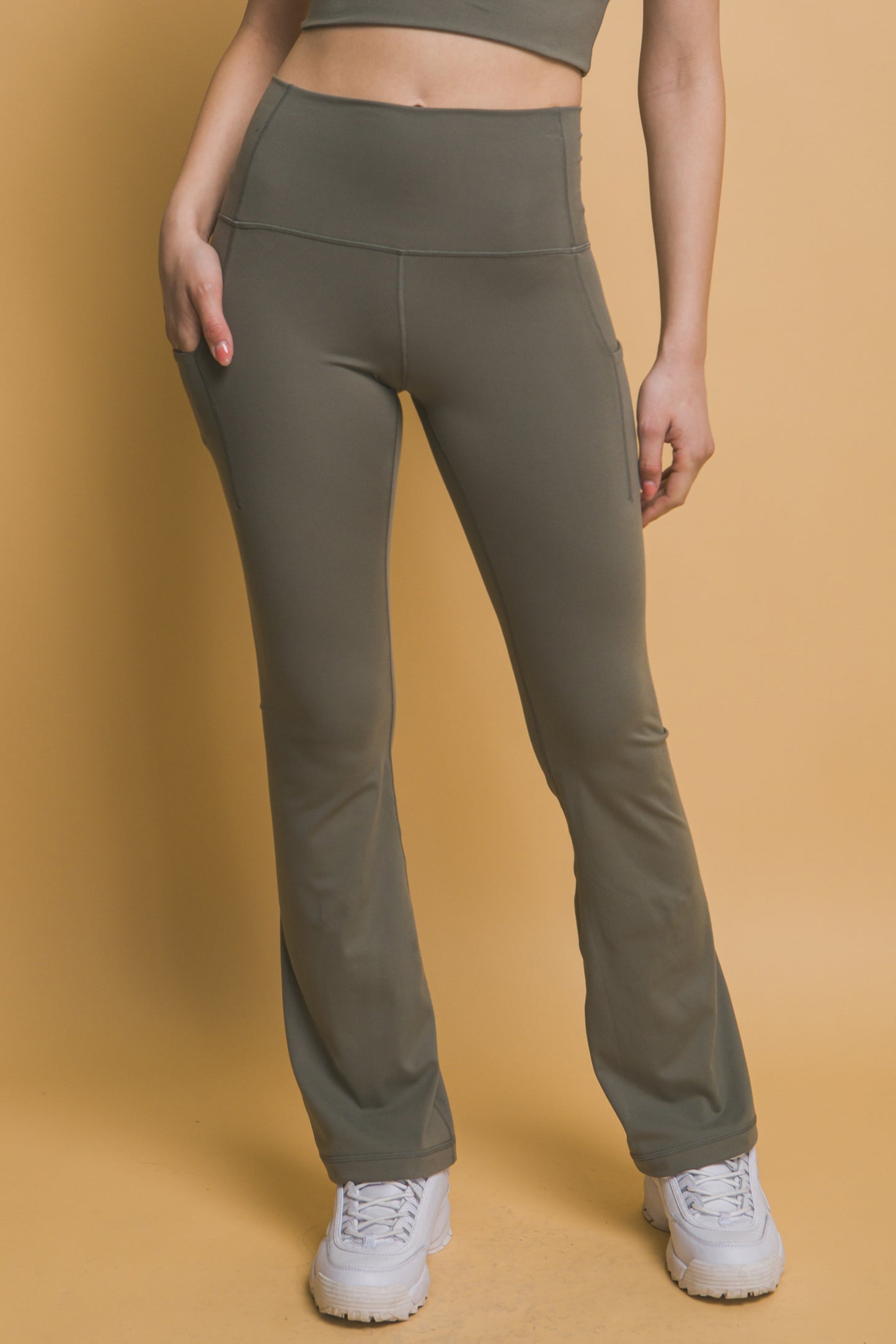 High-Waisted Flared Leggings with Side Pockets; buttery soft fabric; available in sizes XS to XL.