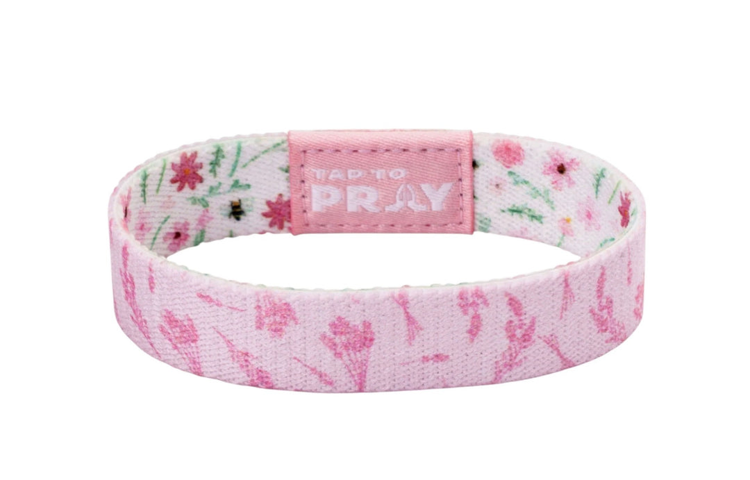 Tap To Pray™ Wristbands - Meadows: pink floral prayer wristband with a rectangular “TAP TO PRAY” embossed pink clasp. Available in multiple sizes.