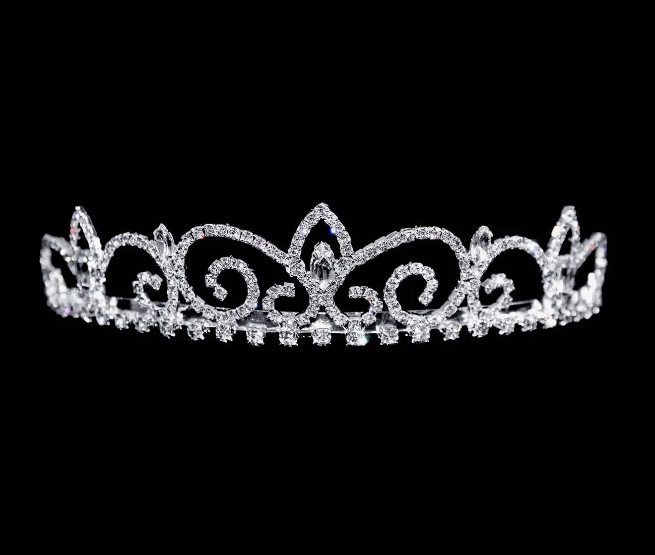 The Royal Regent Tiara with Combs in sterling silver features swirling designs and clear gemstones. Sizes: S, M, L.