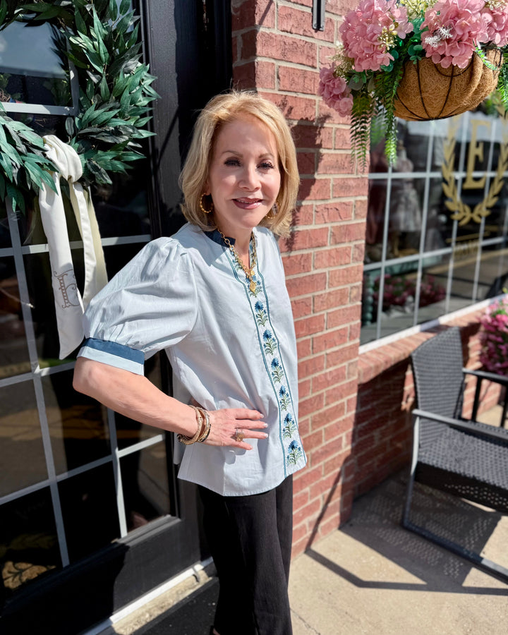 Bluebell Embroidered Blouse with puff sleeves and delicate floral embroidery. Available in sizes XS-XL.