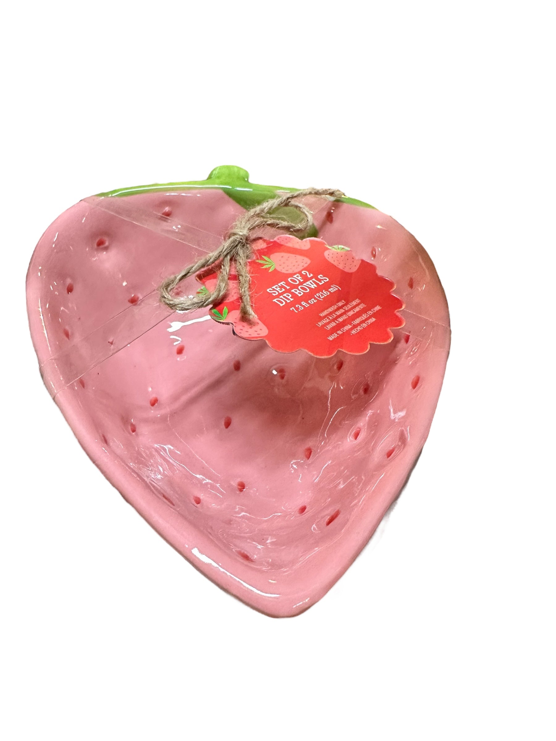 Ceramic strawberry-shaped dip bowl with pink body, green top, string tie, and red tag. Available in small and large sizes.