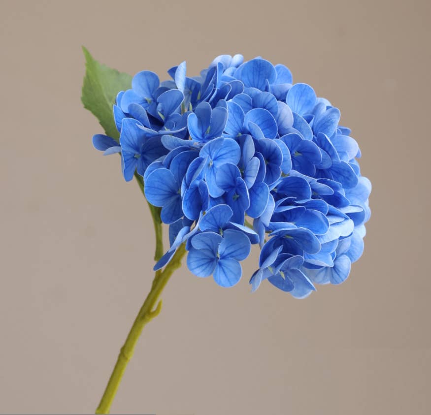 12.5" Real Touch lifelike Hydrangea with soft pink 6” bloom and lush leaves. Available in 12.5" size only.