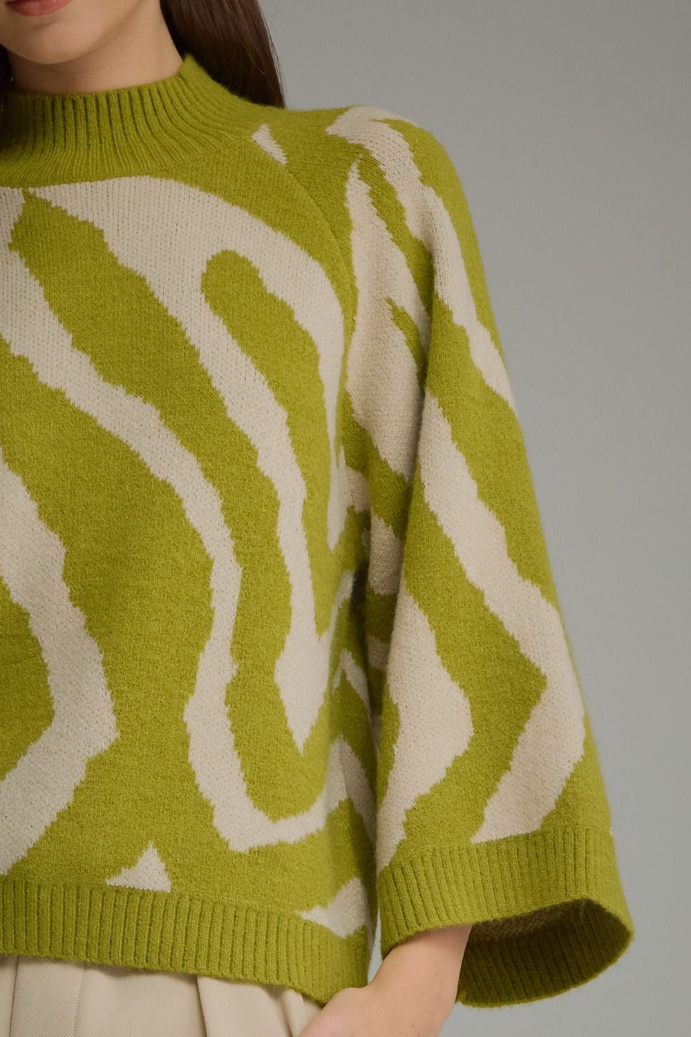 Lime green and cream zebra print mock neck sweater.
