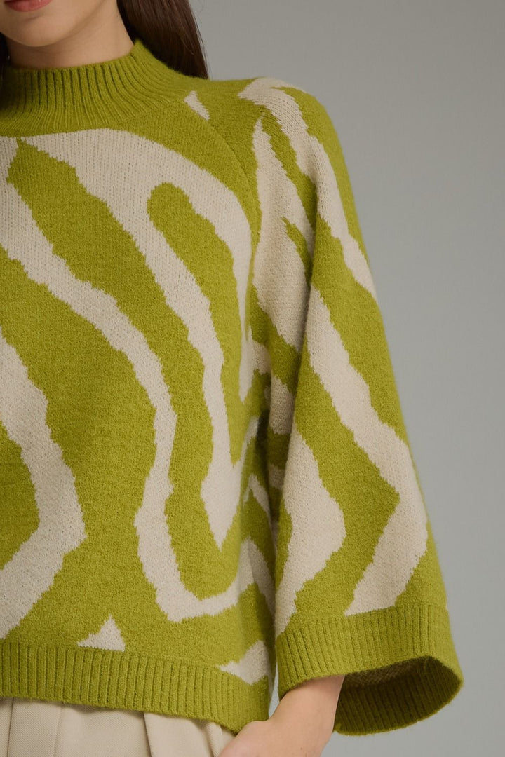 Lime green and cream zebra print mock neck sweater.