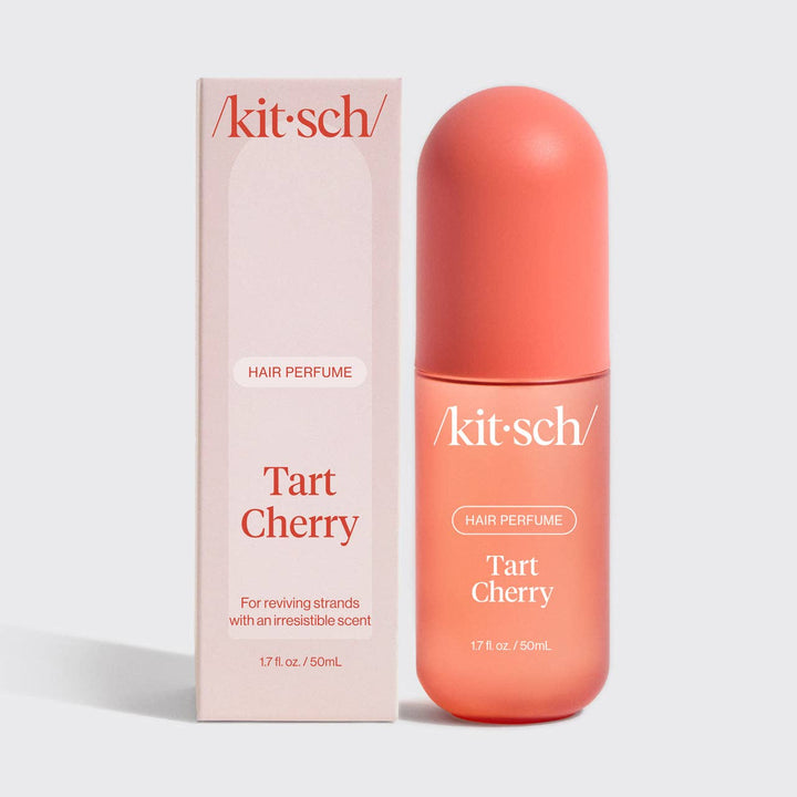 Tart Cherry Hair Perfume, 1.7 fl oz, in a pink box with white and orange text. Travel size; refreshing cherry scent.