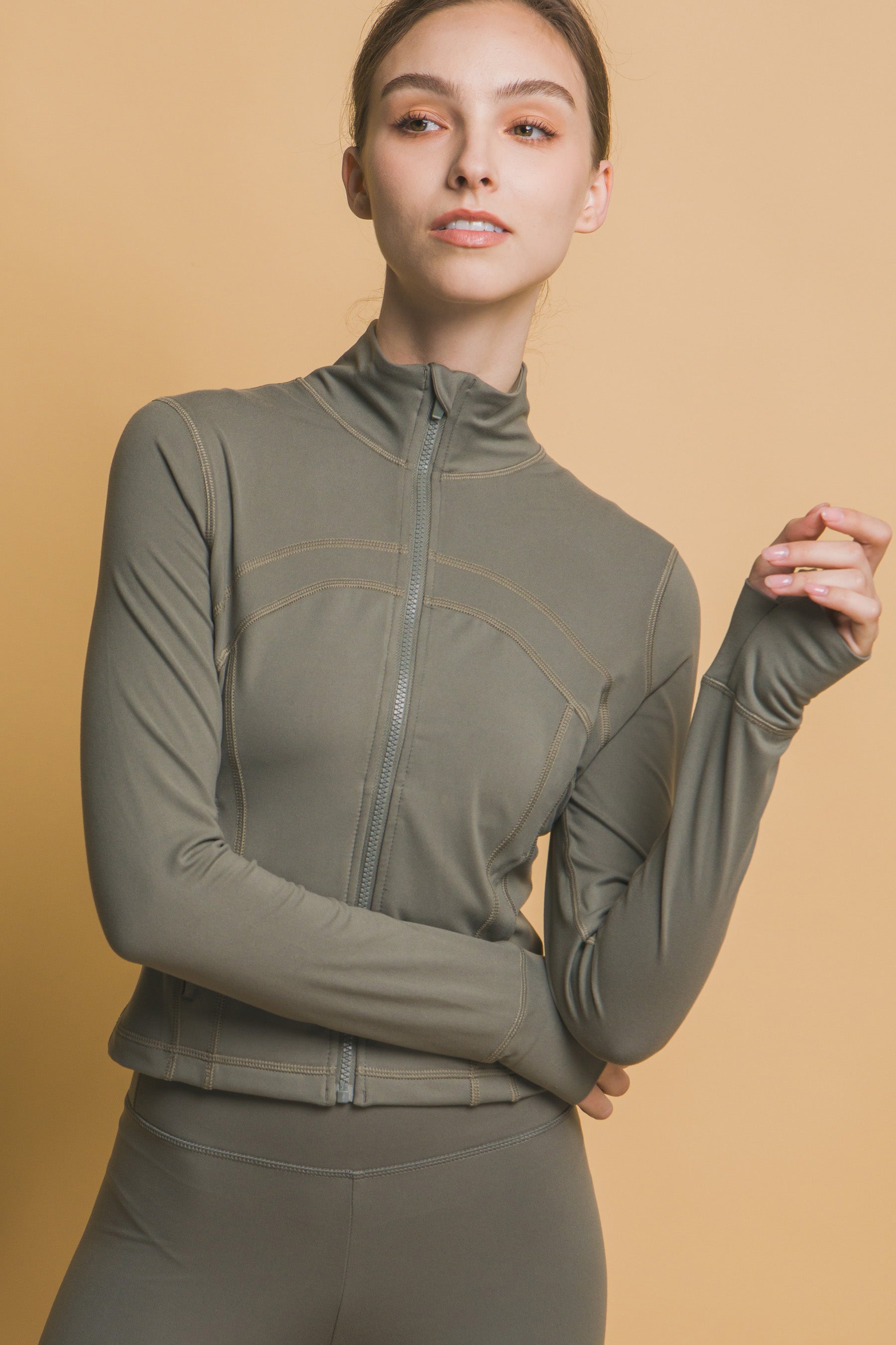 Active Long-Sleeve Zip-Up Performance Top in grey. Made from buttery soft fabric. Available sizes: XS, S, M, L, XL.