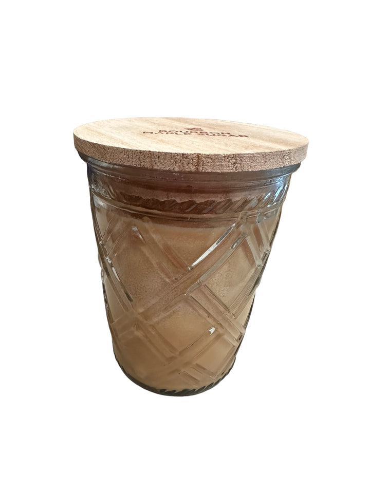 Timeless 12oz jar candle with crisscross glass, light brown Pumpkin Caramel Drizzle wax, and round wooden lid.