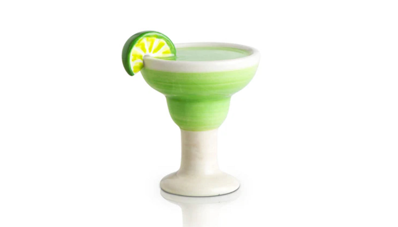Ceramic figurine from the Nora Fleming Minis collection depicting a green margarita glass with a detailed lime wedge. Glossy finish, white base, beautifully crafted segments in green and yellow.

Sizes available: One Size