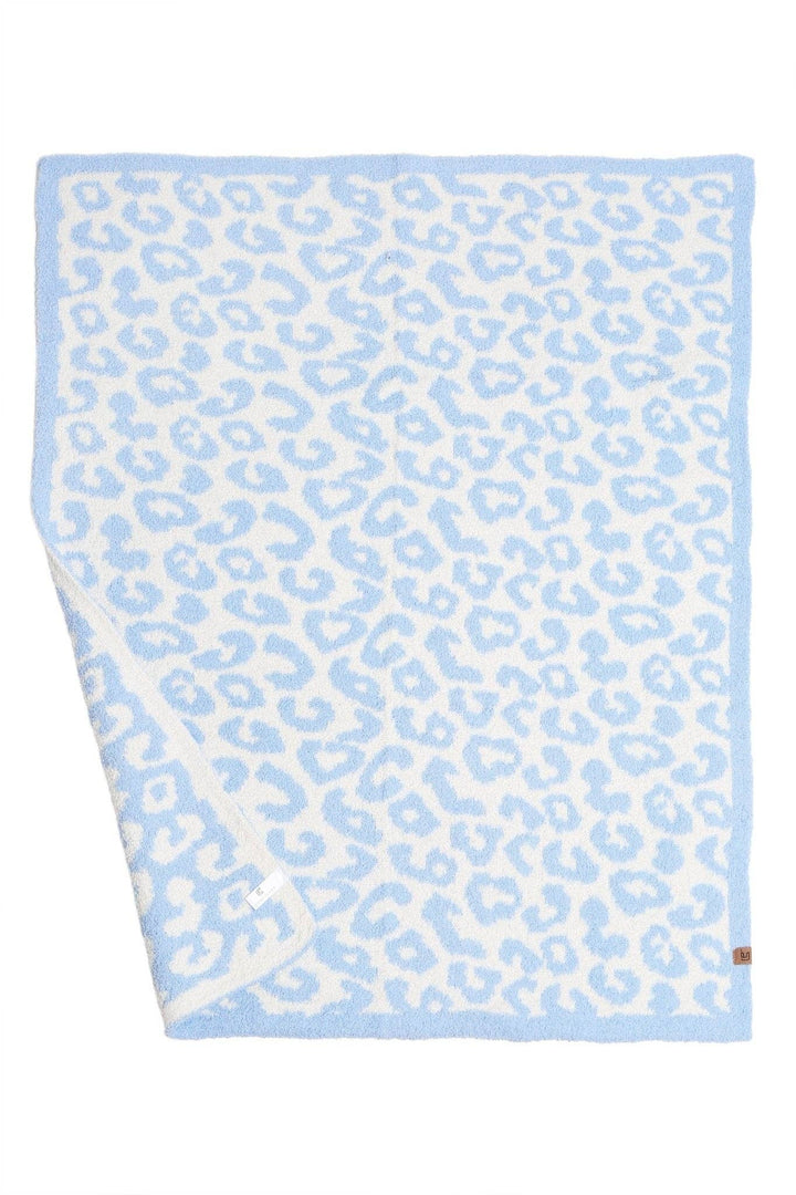 Beige polyester microfiber kids’ blanket with light blue and white leopard print. Sizes: small, medium, large.