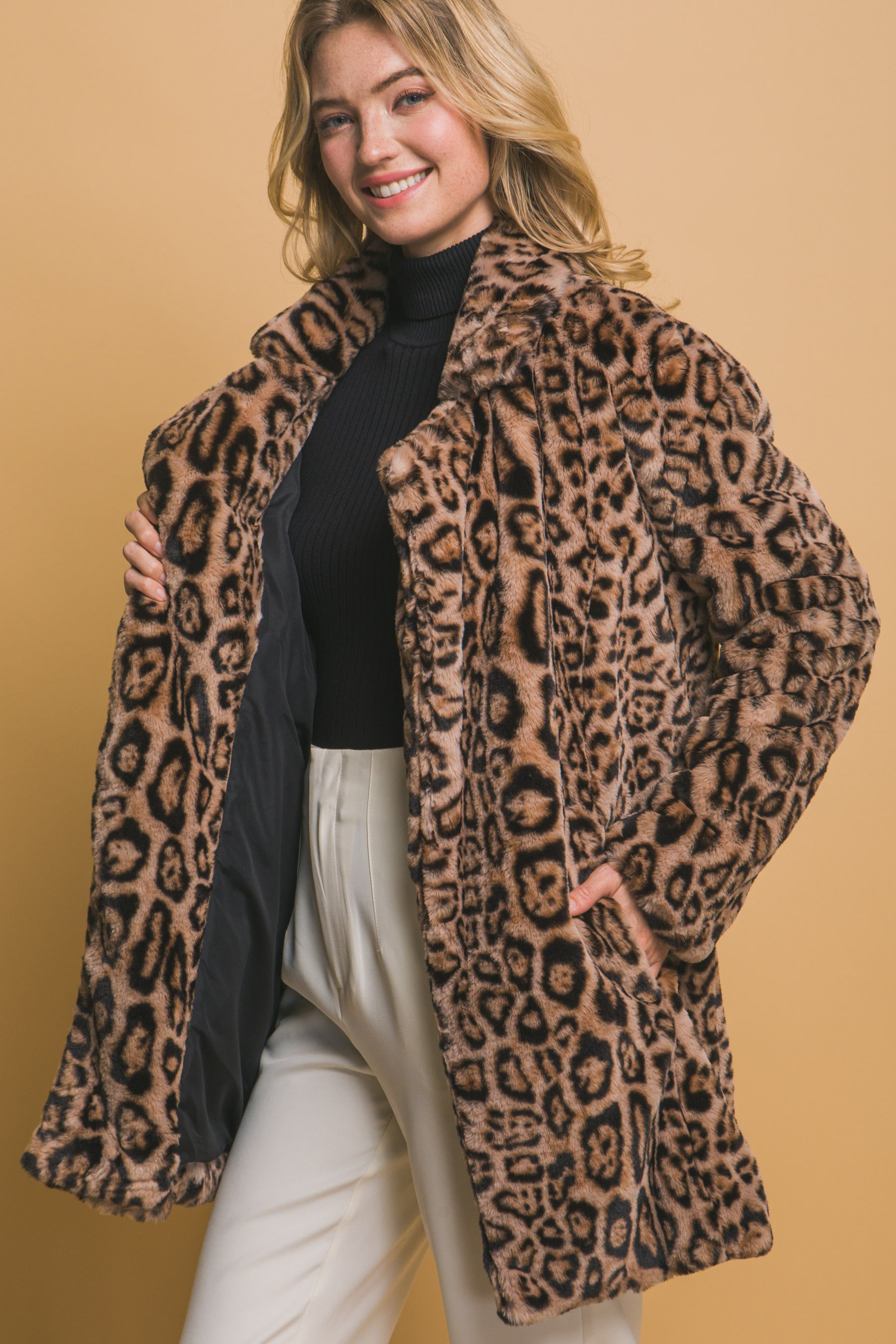 Animal Print Faux Fur Coat: This elegant coat features a stylish animal print design, perfect for adding a touch of luxury to any outfit. Available in sizes XS to XL.