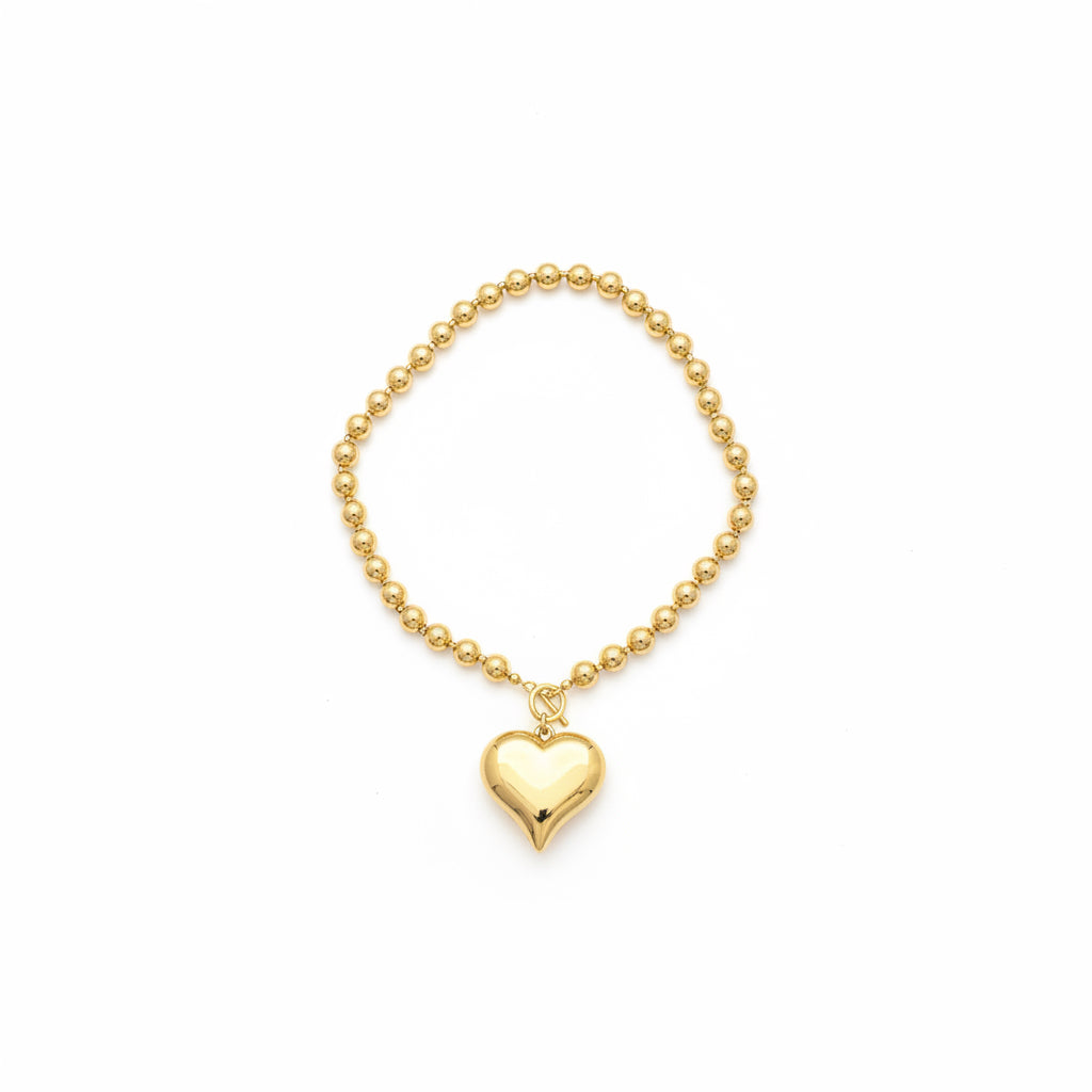 Gold Heart Necklace with shiny heart-shaped charm, available in 16″, 18″, and 20″ lengths.