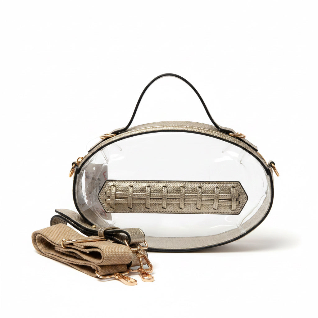 Oval-shaped, transparent stadium purse with gold hardware, tan leather accents, black handle, and removable tan strap. Available in small and medium sizes.