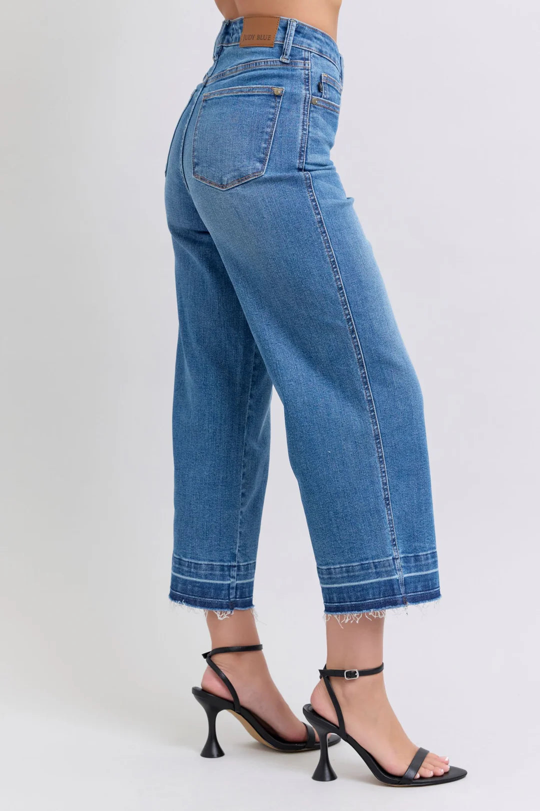 Judy Blue HW Control Release Hem Crop Wide jeans with frayed hems. Available sizes: 24–32, 14W–24W.