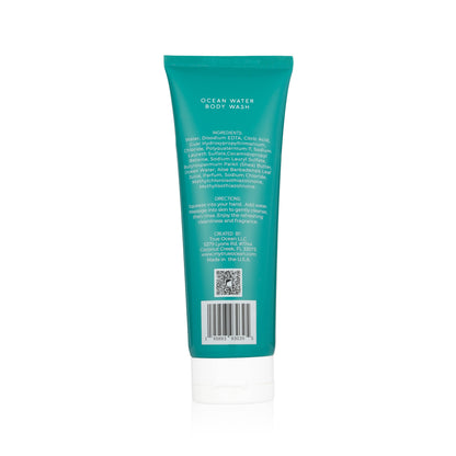 Back of teal "True Ocean Body Wash" tube, 8.5 oz size, with text and QR code emphasizing a coastal scent.