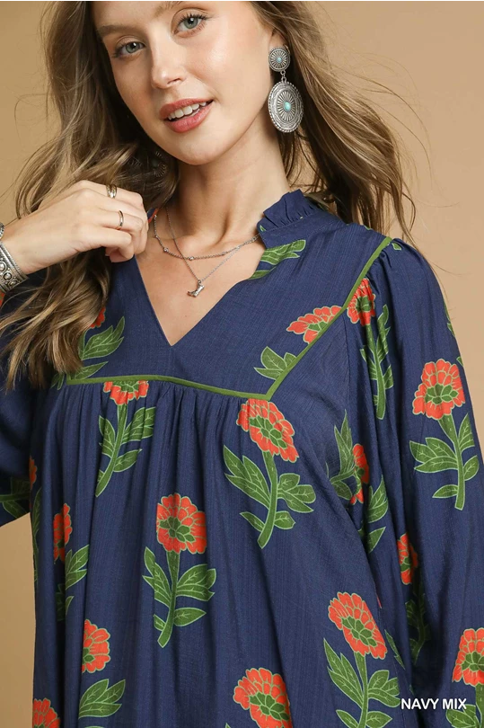 Kelly Navy Mix Dress—v-neck mini with red and green floral print. Available in sizes XS–XL.