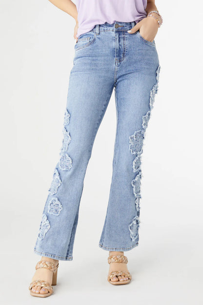 Everstretch Baby Bootcut Ankle Flower Jeans in light blue with frayed floral patches, 4-way stretch. Available in sizes 24-32.