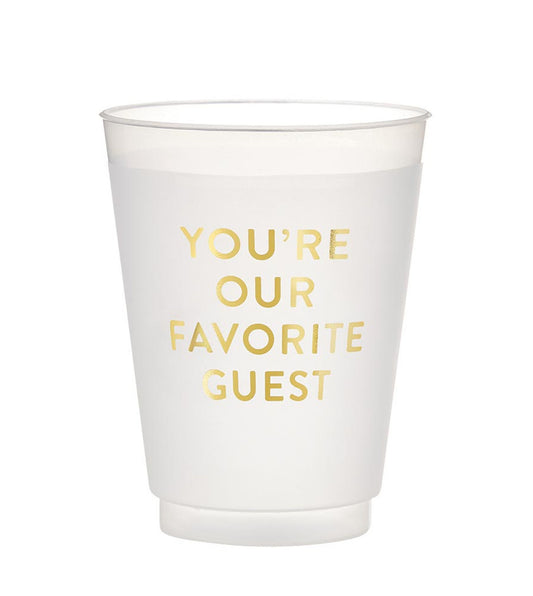 The Frosted Cups feature a reusable design with elegant gold text that reads "YOU'RE OUR FAVORITE GUEST." Available in sizes: 12 oz, 16 oz, and 20 oz.
