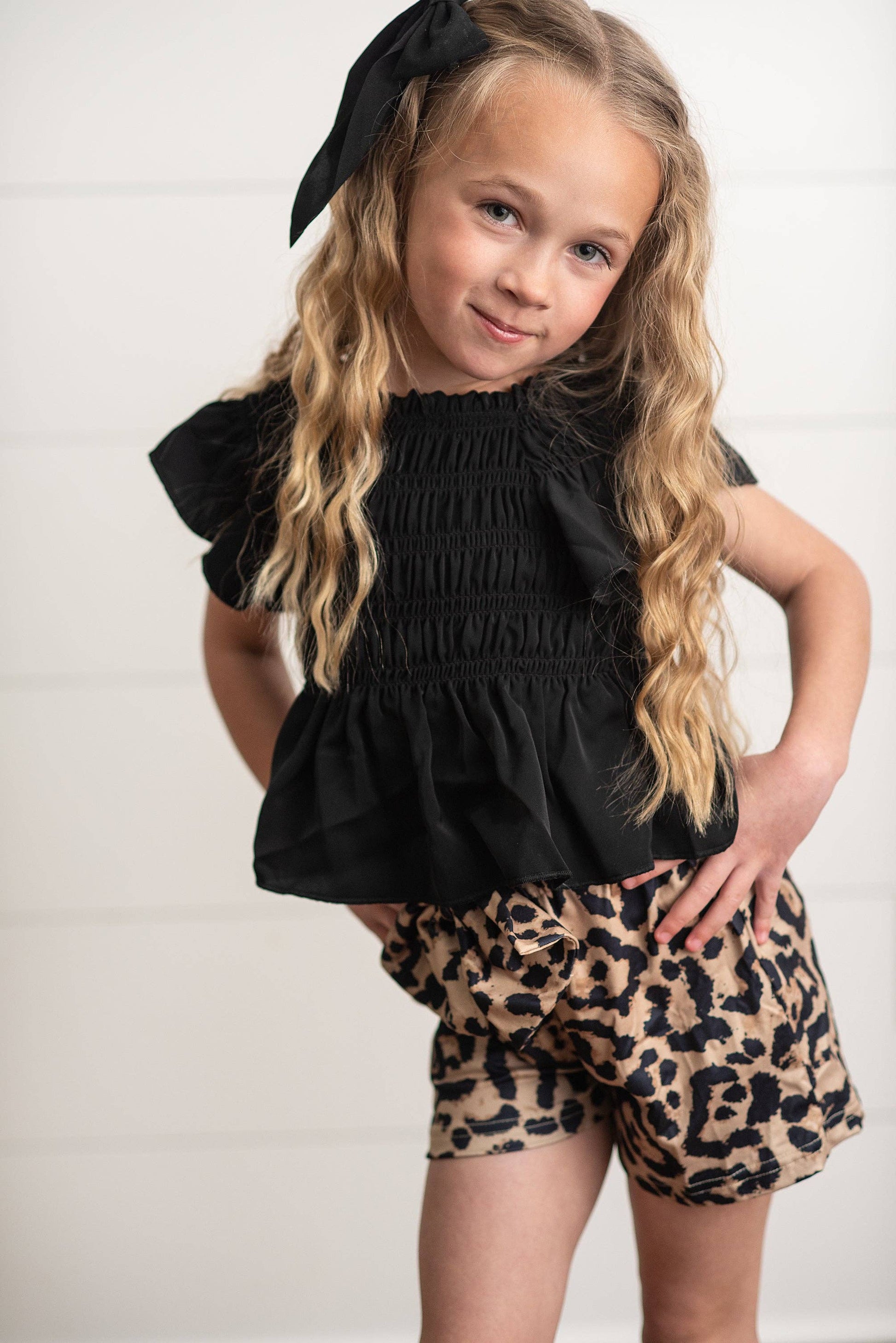 Girls Leopard Shirred Short Set with shirred waist and leopard print. Available in sizes XS-XL.